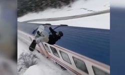 Trenin üzerinden snowboard ile atladı!