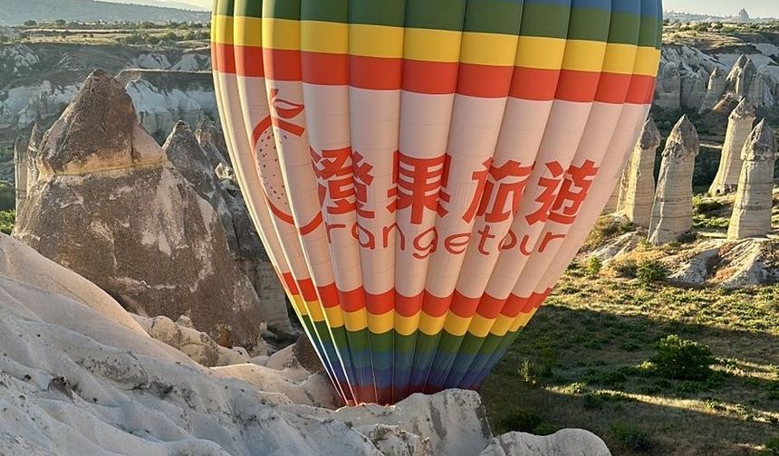 Balon pilotu 20 kişinin hayatını kurtardı