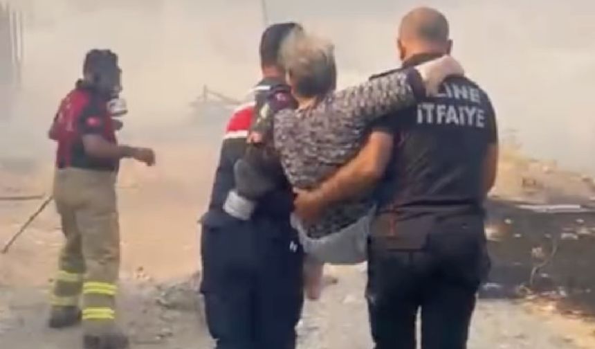 Yaşlı kadın alevlerinden arasından kurtarıldı