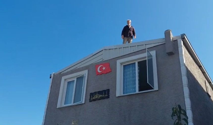 Çatıya çıkıp yıkıma direndi!